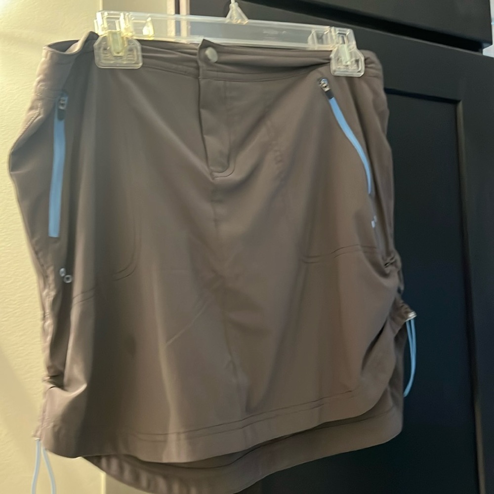Great skirt for summer with shorts attached underneath. Grey/blue details